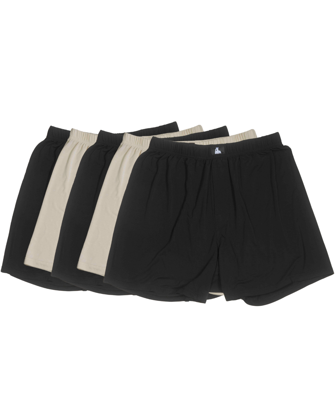 Flat lay of non-toxic bamboo men’s underwear in black and beige, fertility-safe and breathable.