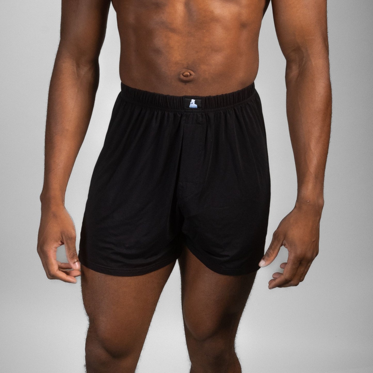 Close-up of male model in black Mr. Fertyl fertility-safe boxers, made from breathable bamboo Lyocell for comfort and health