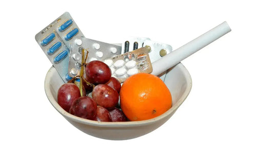 Bowl with fruit, pills, and supplements representing top 10 male fertility supplements for boosting sperm health naturally.