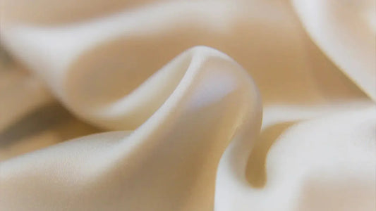Close-up of smooth beige fabric symbolizing chemical-free underwear, safe and gentle for fertility and health.