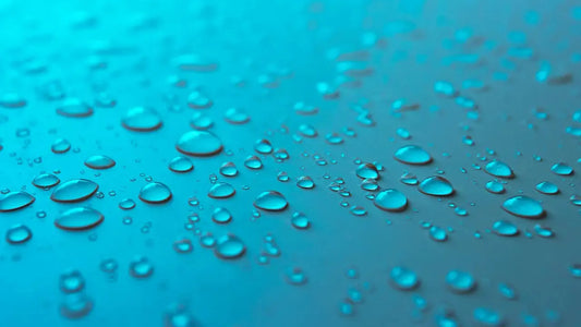 Water droplets symbolizing semen volume and how to cum more by boosting natural fertility and reproductive health.