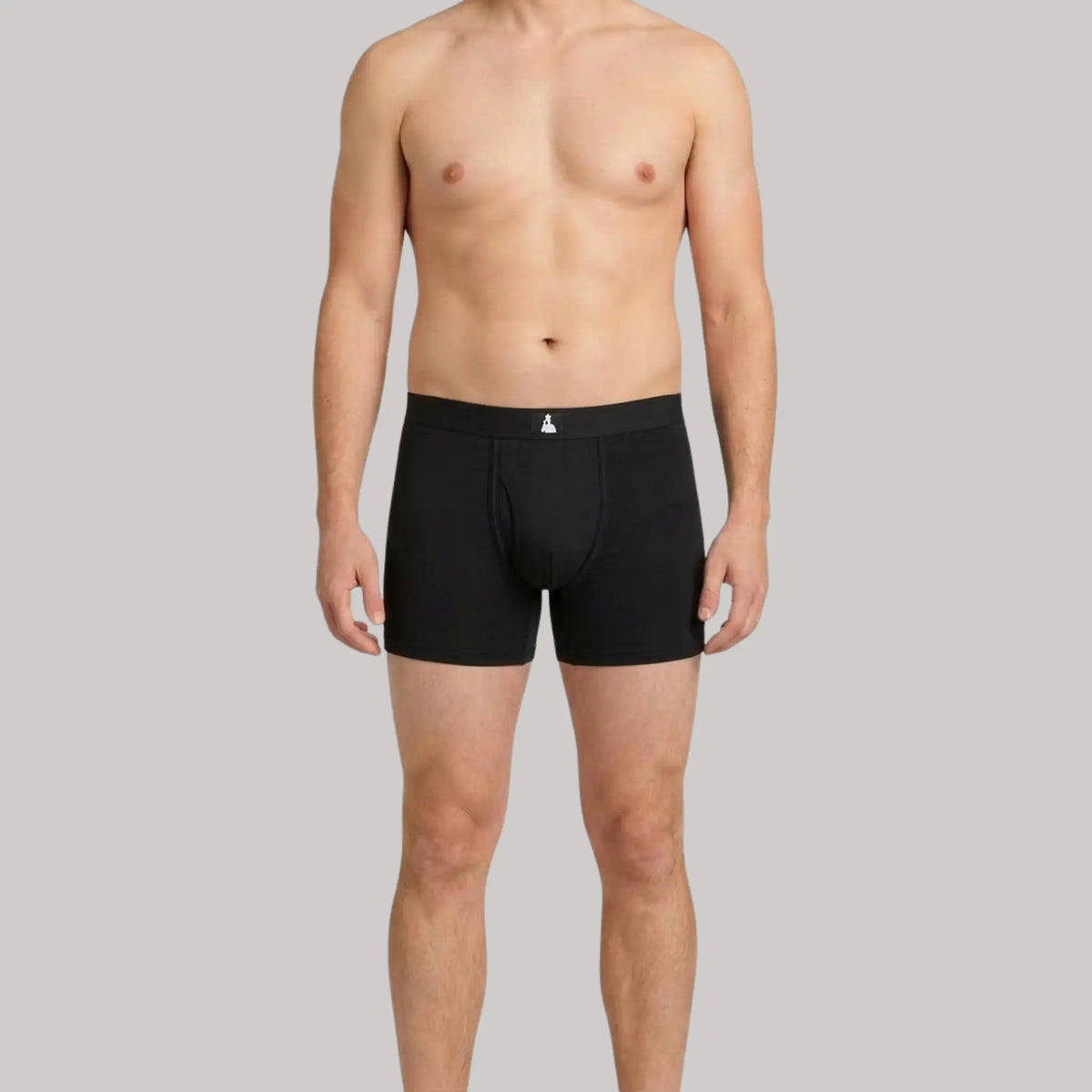Front view of male model in black Mr. Fertyl Bamboo Lyocell boxer brief's, showcasing breathable, non-toxic fertility-safe fabric.